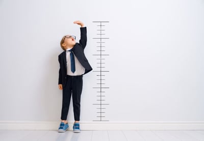A child against a growth chart - how to grow a property management business concept