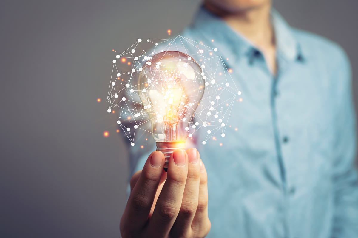 Male holding lightbulb