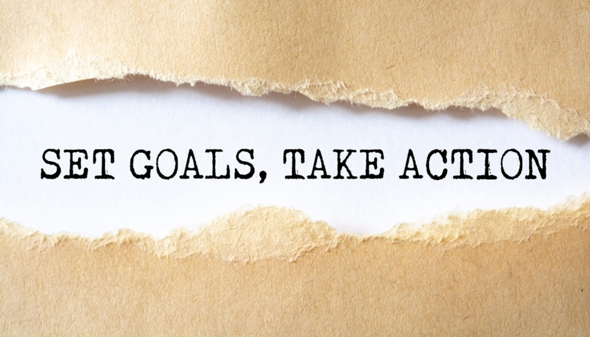 Set Goals - take Action on paper - growing a property management business concept