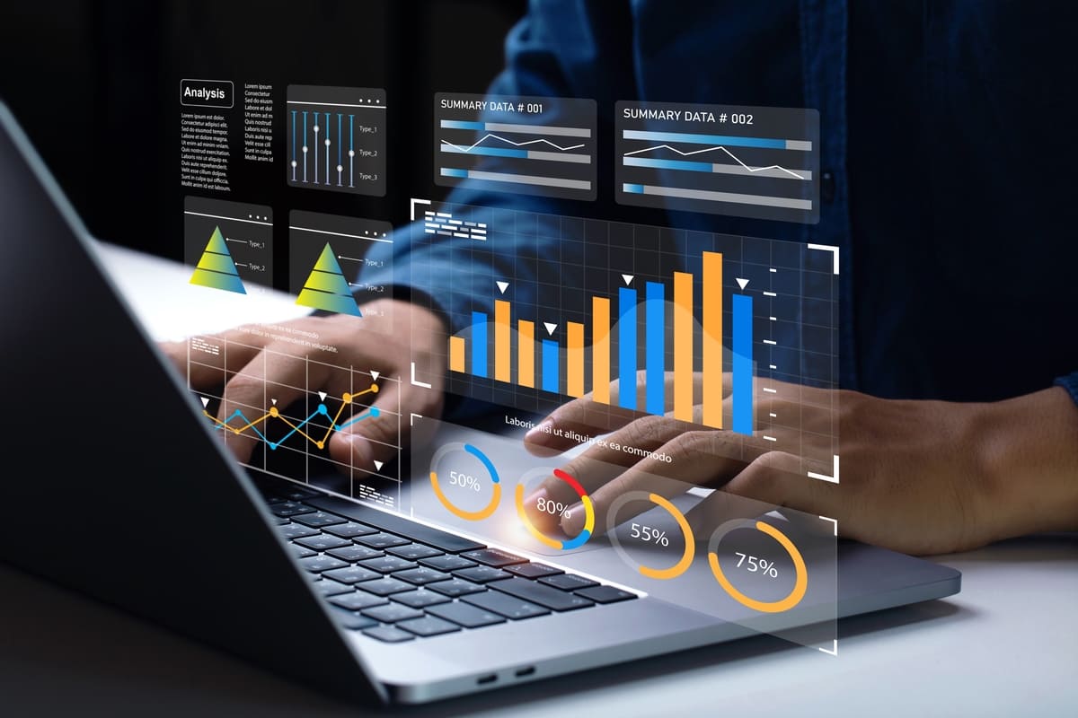 someone looking at data on a laptop for market analysis
