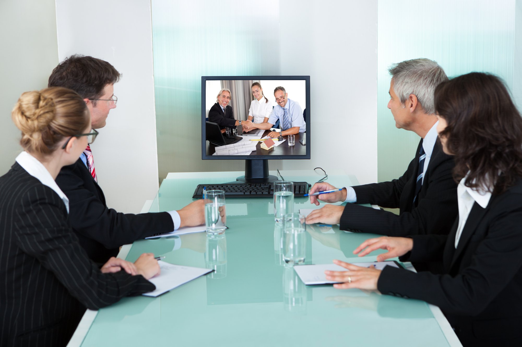 Businesspeople watching an online presentation