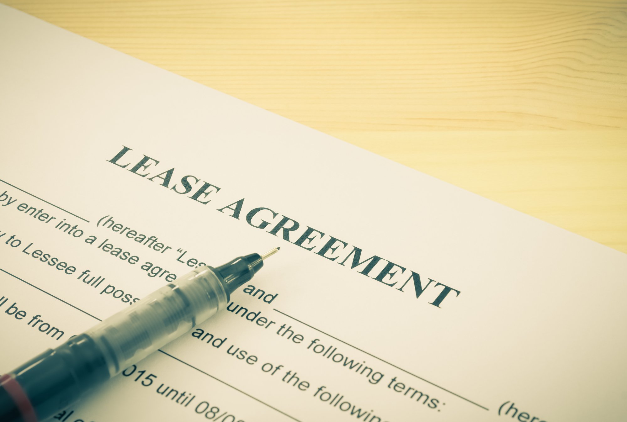 Lease Agreement Contract Document and Pen Bottom Left Corner Vintage Style
