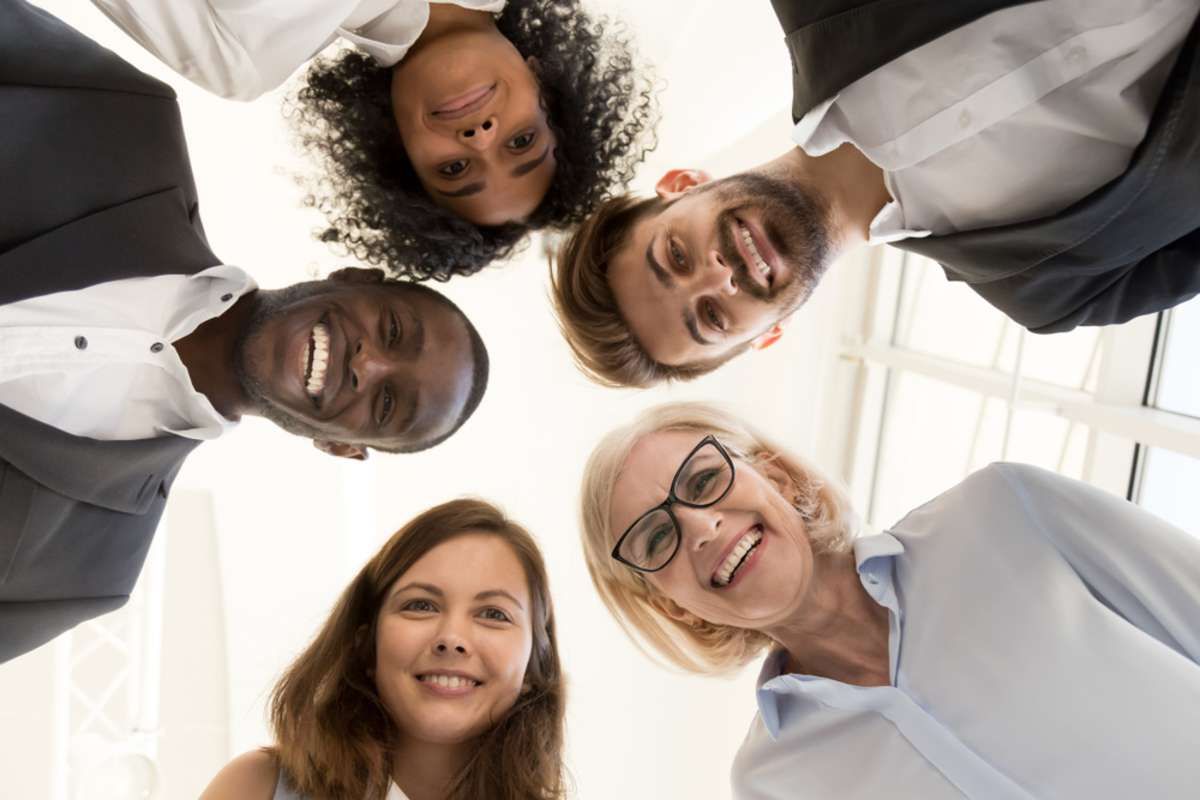 Portrait of happy friendly multi-ethnic team business people faces