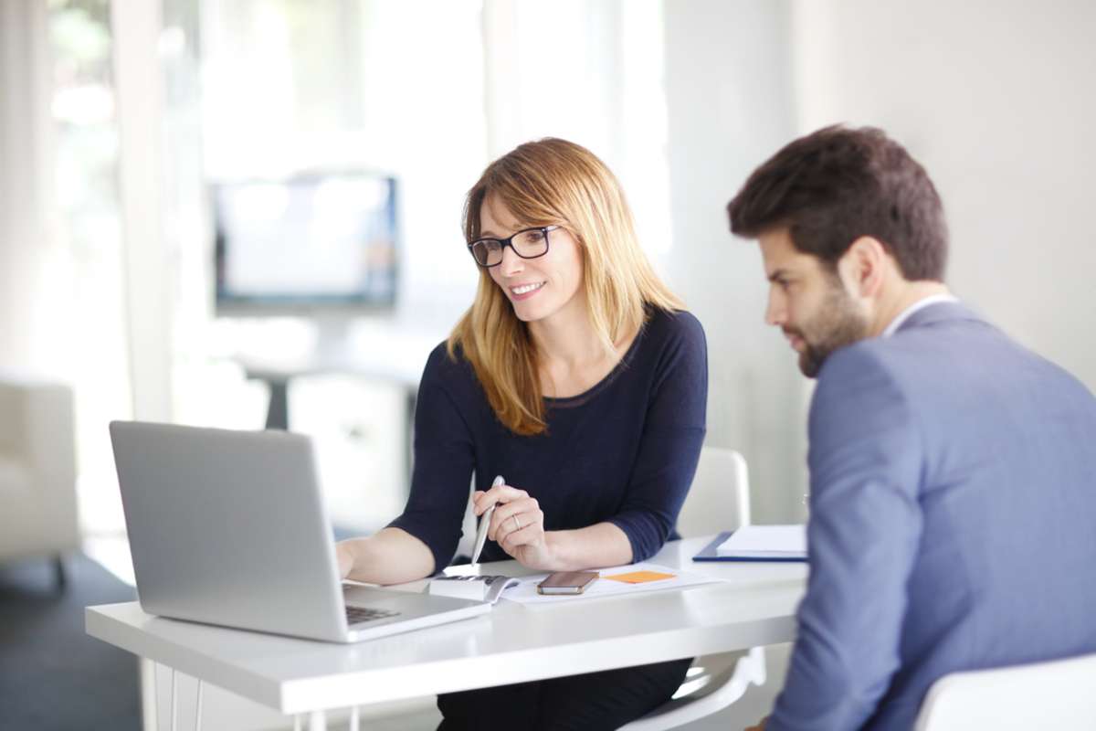 Portrait of investment advisor businesswoman sitting at office