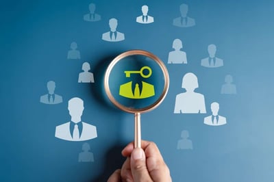 A magnifying glass highlights a key above a person icon, property management org chart concept