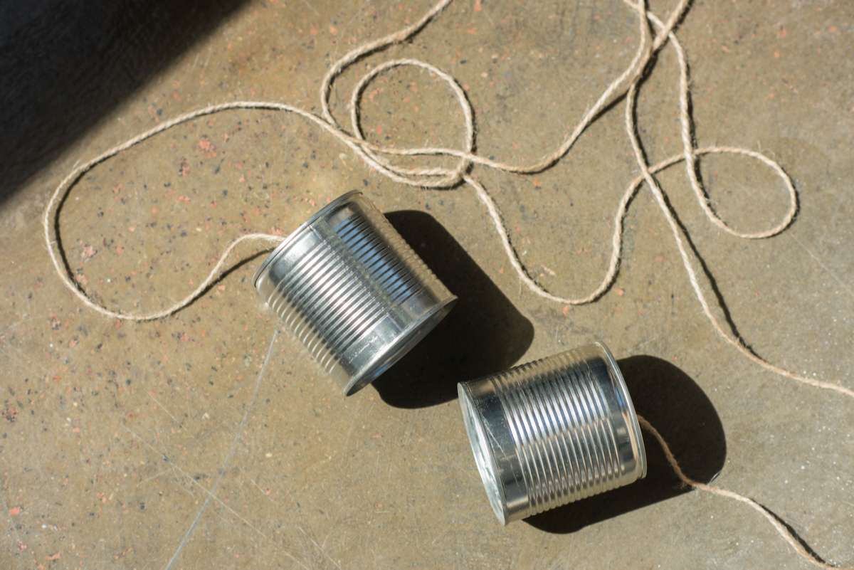 Aluminium tin cans connected with rope