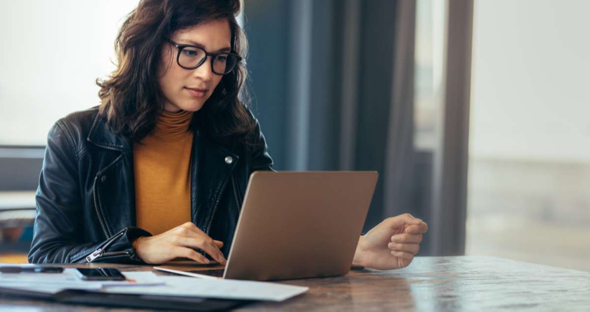 Business woman busy working on laptop computer at office