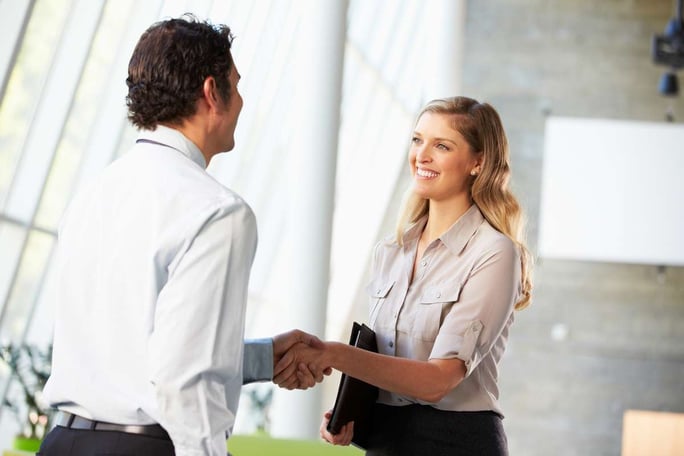 Businessman and Businesswoman Shaking Hands In Office, property management consultant concept. 