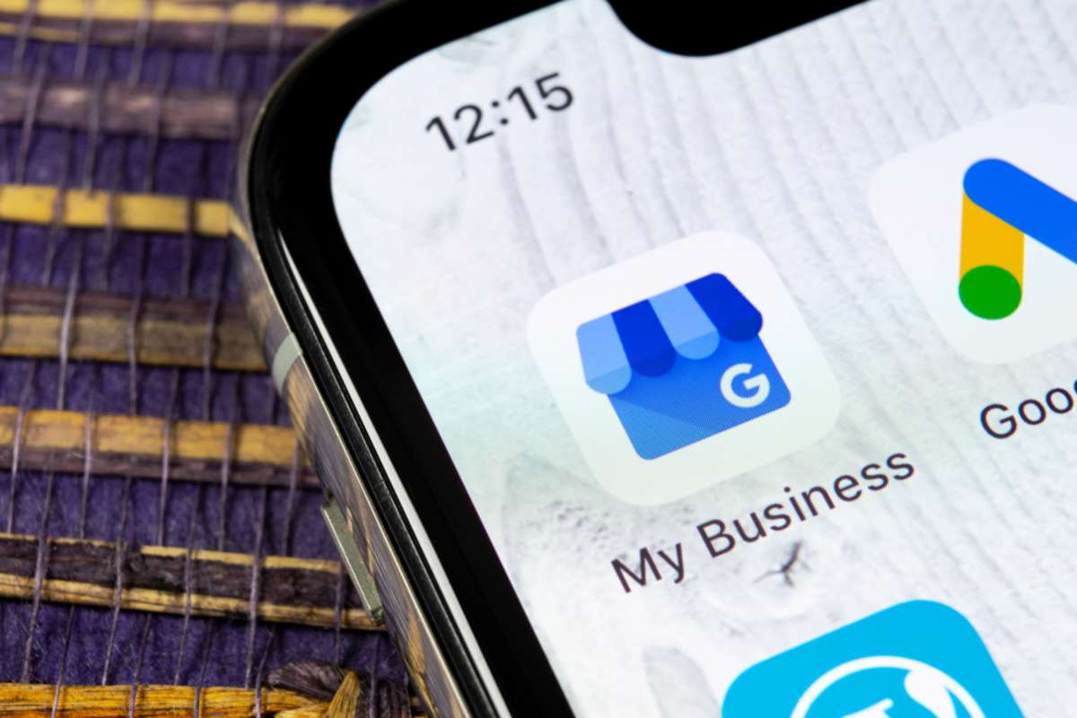 Google My Business application icon on Apple iPhone X screen close-up