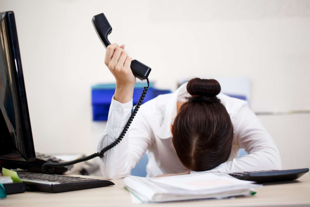 Young attractive business woman with phone in hand