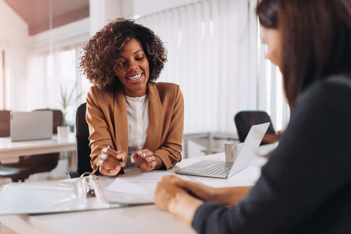 A businesswoman talking to a client