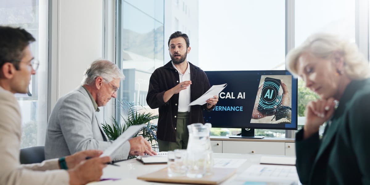 A man giving a presentation on AI to a team
