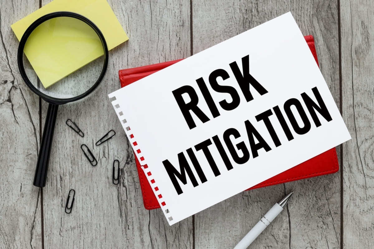 A notebook that says risk mitigation