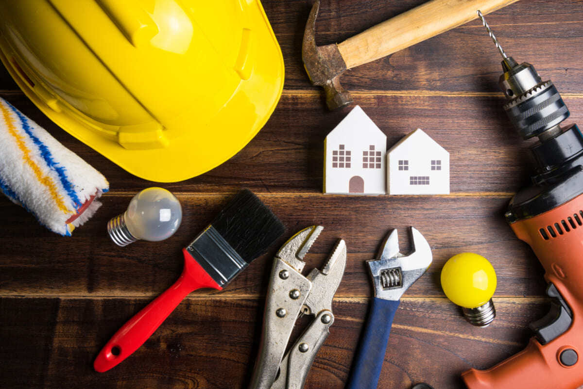 Maintenance tools around a wooden model house
