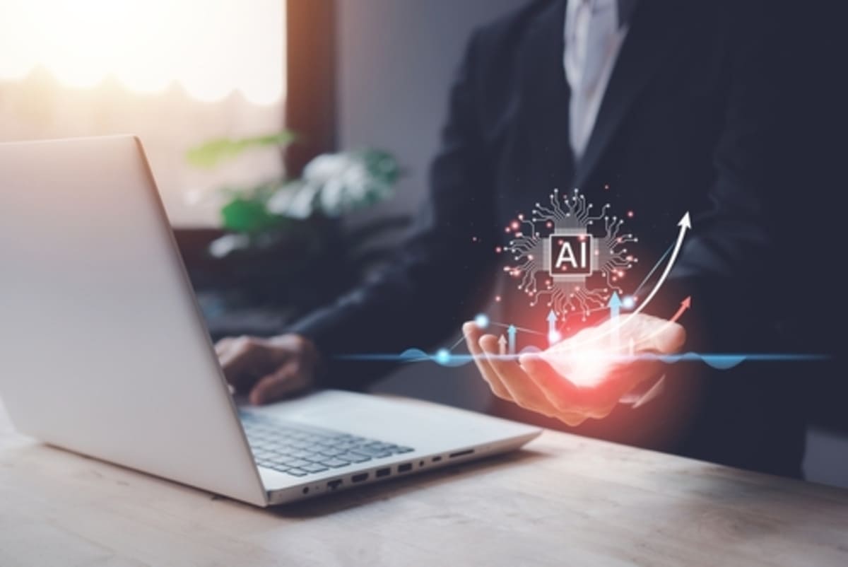a businessman holding out his hand with an AI logo above it