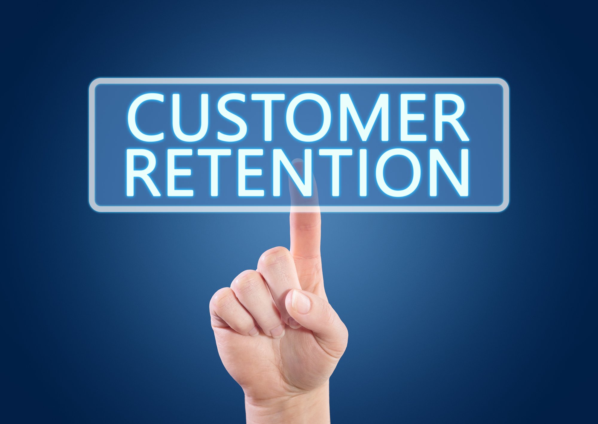 The words customer retention being pointed at by a hand