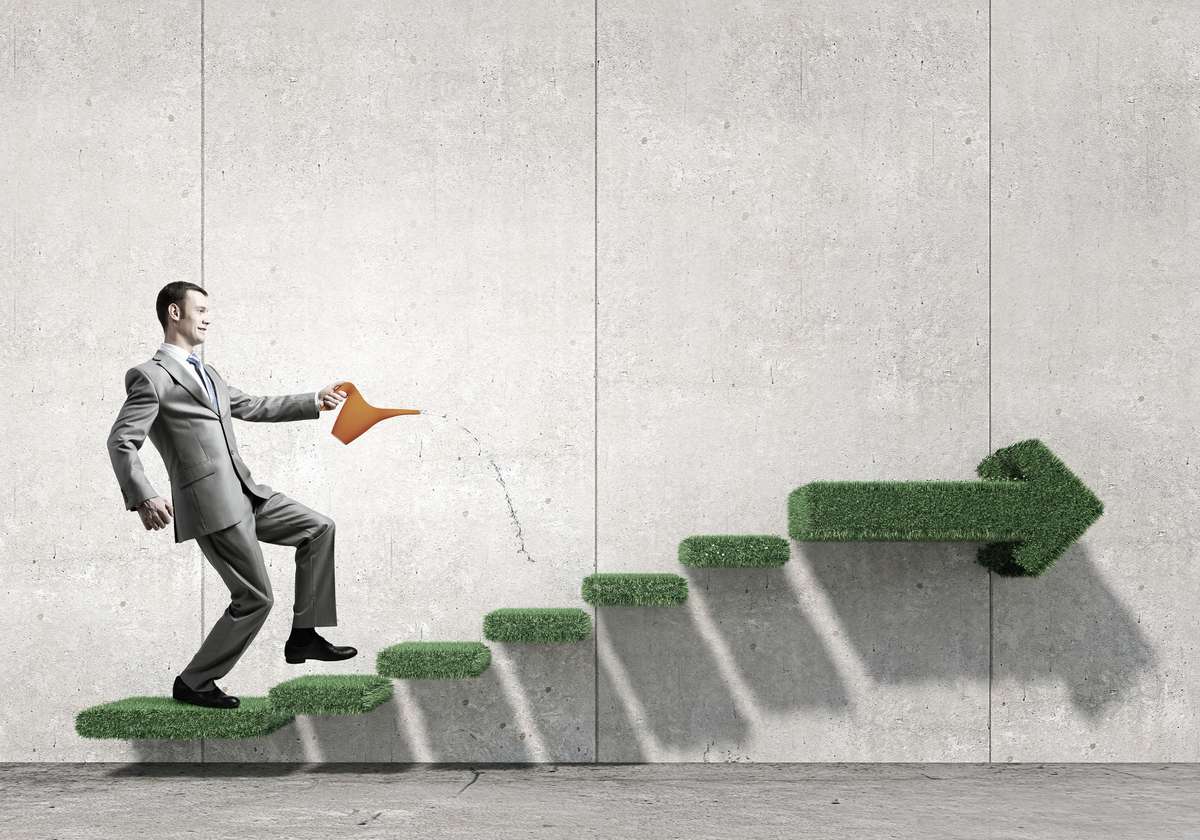 Illustration of a businessman watering the steps as he goes up