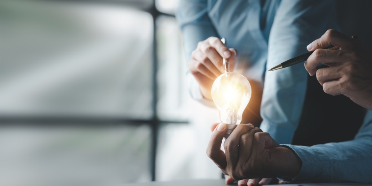 7 Businessman holds a glowing lamp, Creative new idea