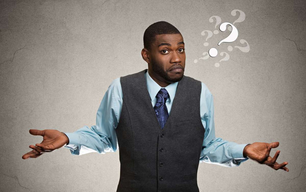 Closeup portrait dumb looking clueless business man, arms out asking why what's problem so what I don't know