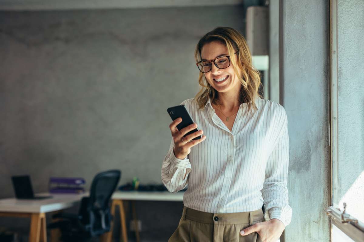 Happy tenant using her phone