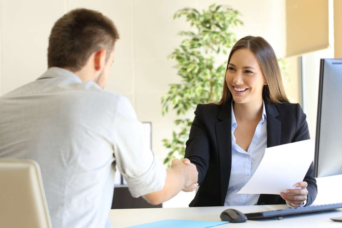 Two business people handshaking 