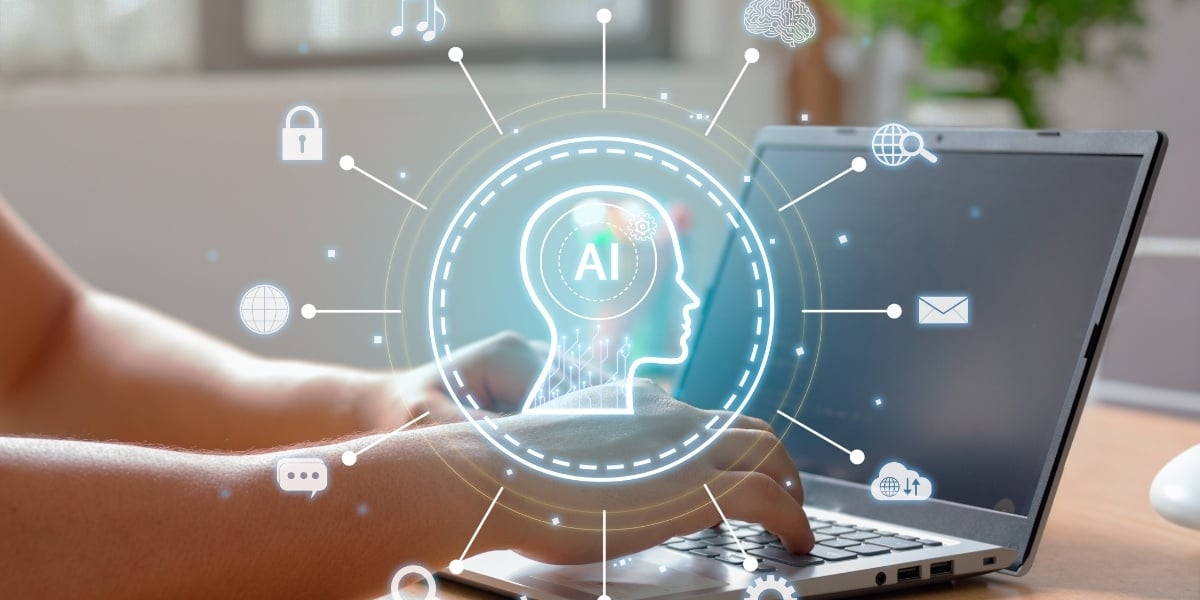 Someone working on a laptop with an AI icon and other related symbols.
