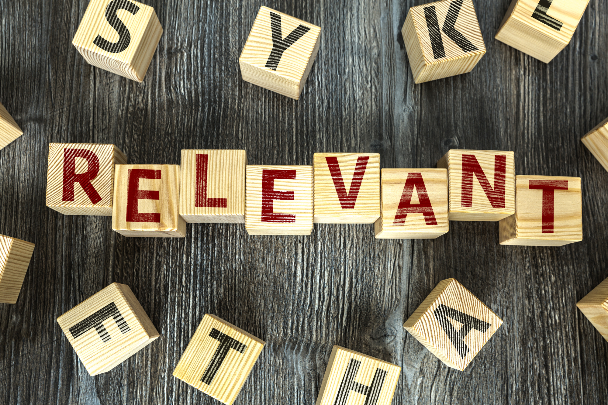 The word relevant spelled in wooden tiles